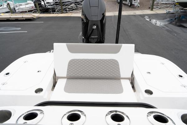 Slide: The Image of 2024 Caymas 28 HB boat stern with seating and Mercury outboard motor. - 9