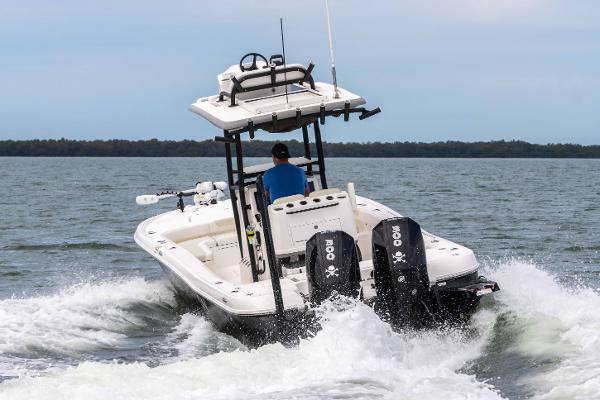 Slide: The Image of 2022 Caymas 281HB Center Console boat cruising on open water. - 5