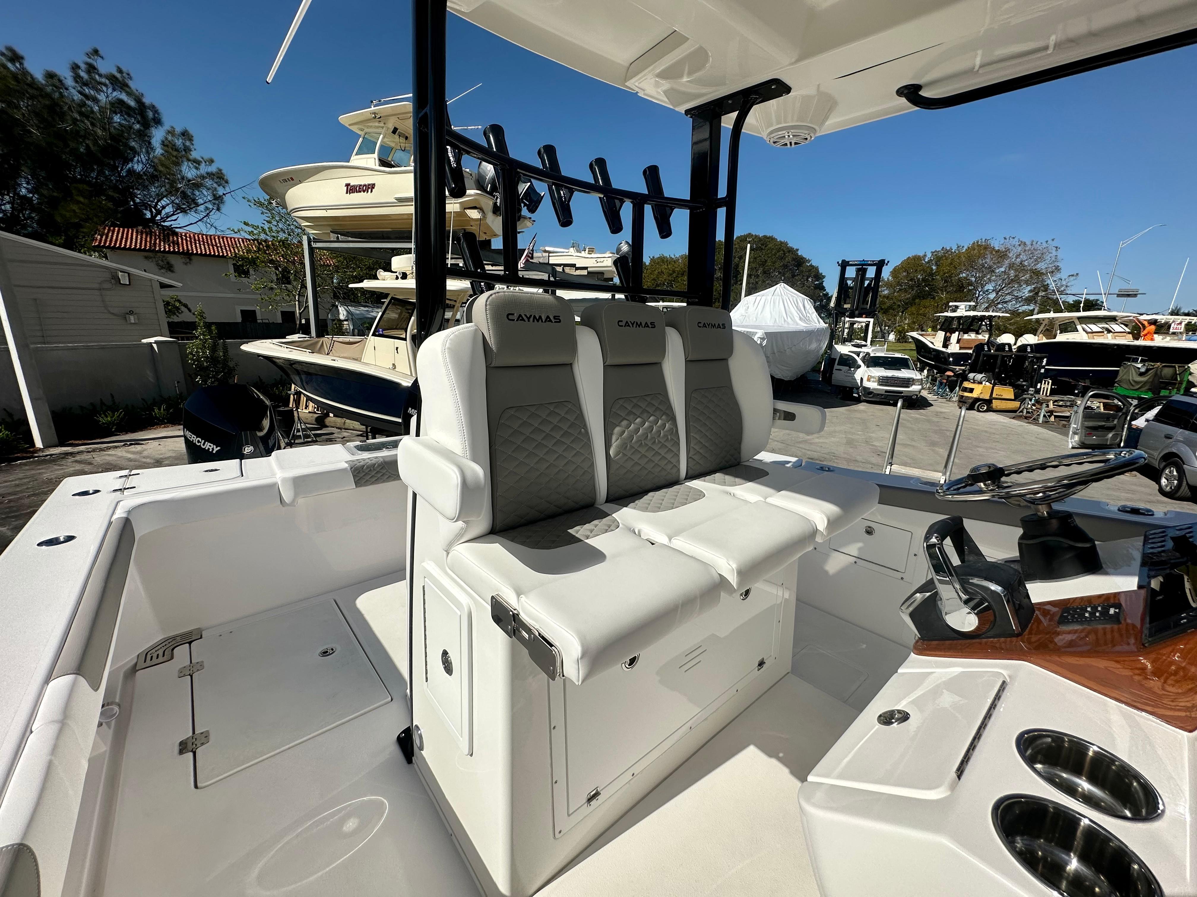 Slide: The Image of 2024 Caymas 30 CT boat interior with seating and steering console. - 3