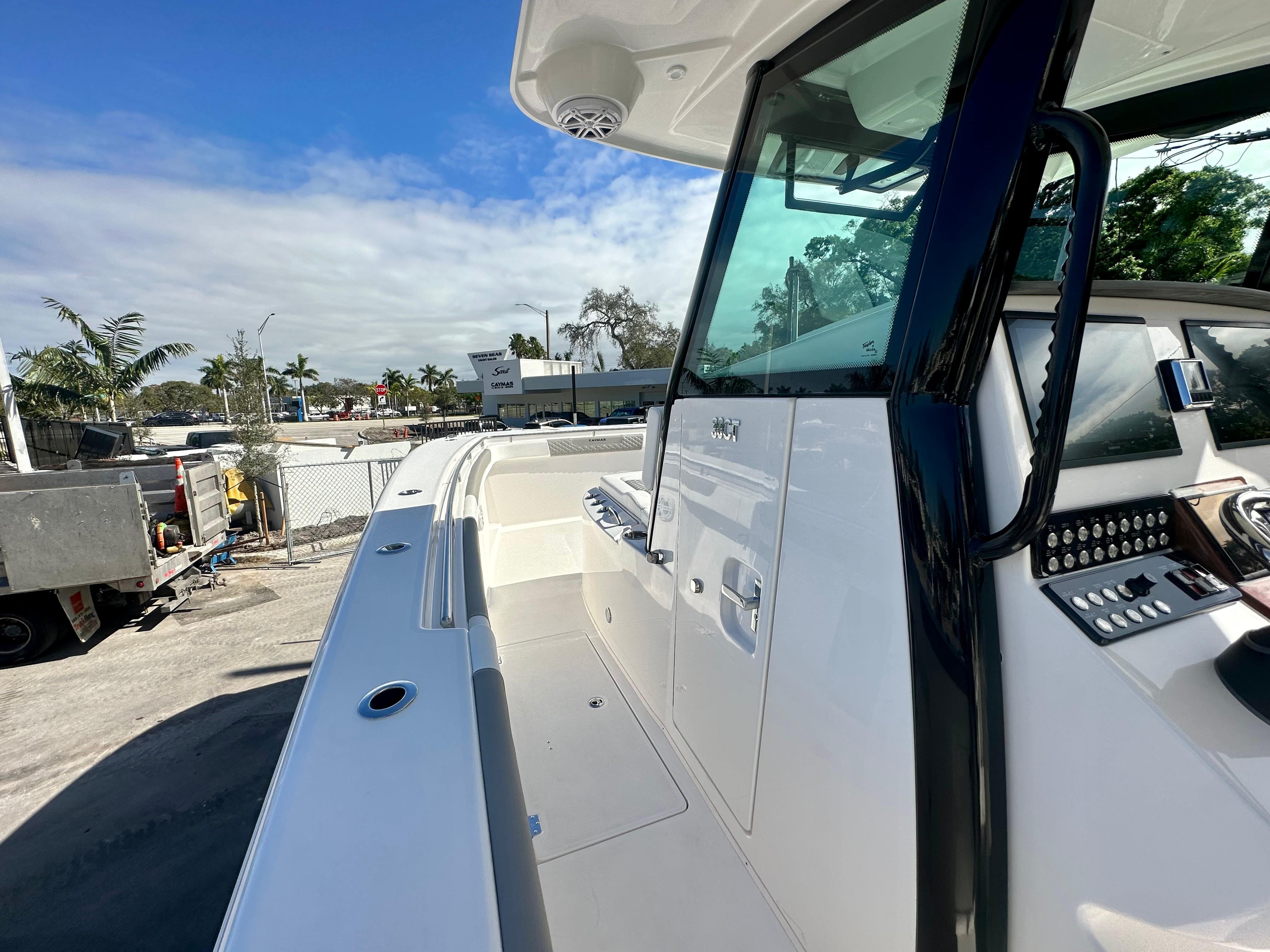 Slide: The Image of 2024 Caymas 30 CT boat exterior and cockpit view. - 5