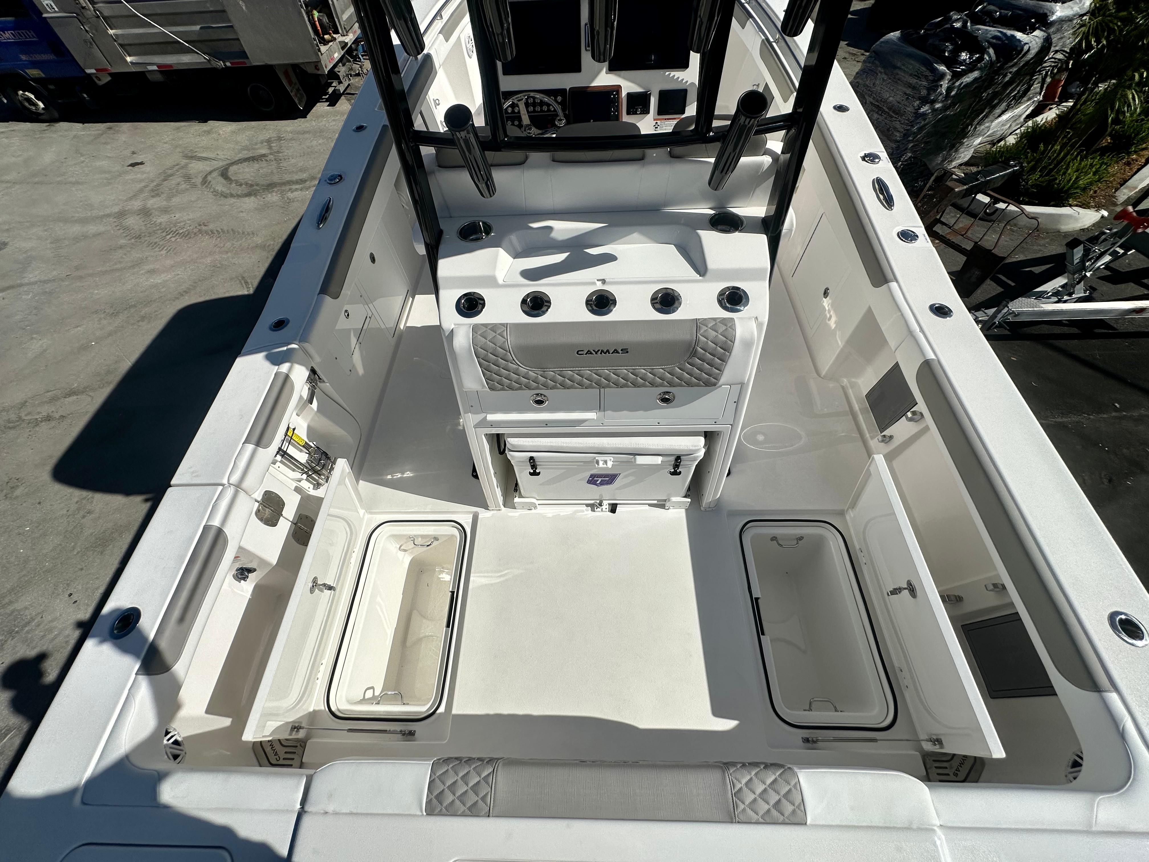 Slide: The Image of 2024 Caymas 30 CT boat interior with storage compartments and seating. - 8
