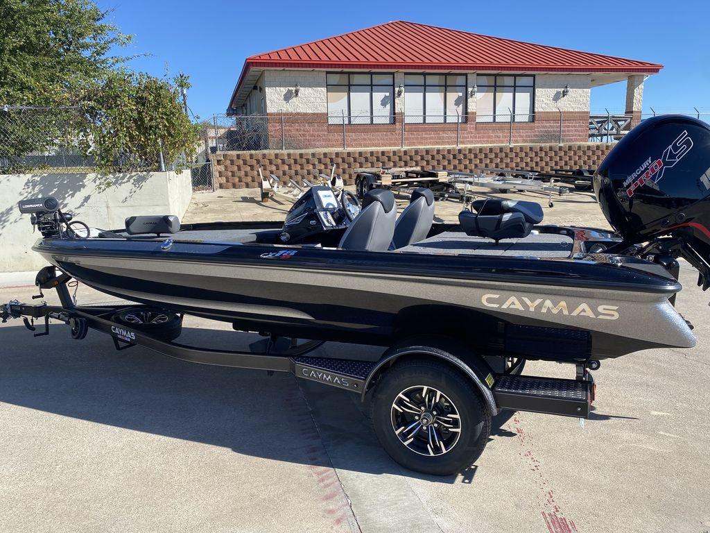 Slide: The Image of 2023 Caymas CX18 SS fishing boat on trailer, parked outdoors. - 3
