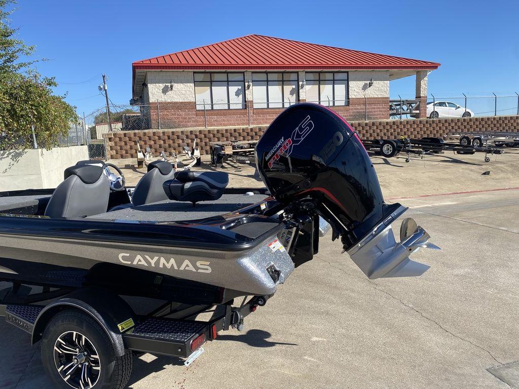 Slide: The Image of 2023 Caymas CX18 SS boat with Mercury Pro XS engine in a parking lot. - 4
