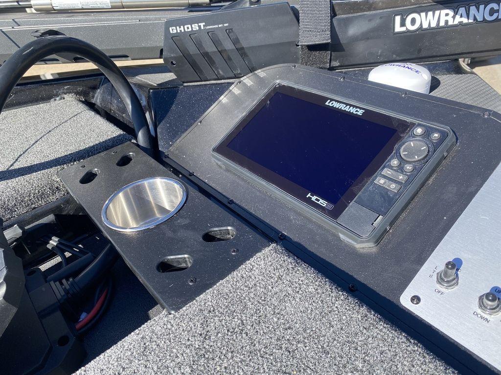Slide: The Image of 2023 Caymas CX18 SS boat dashboard with Lowrance HDS9 display and Ghost trolling motor. - 9