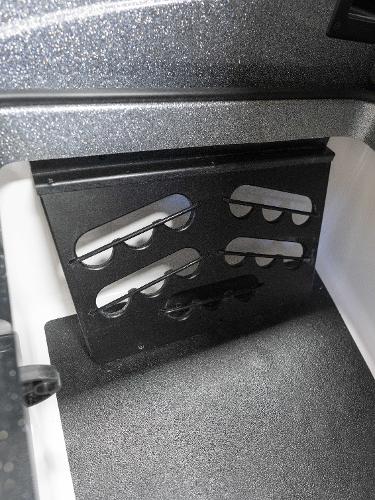 Slide: The Image of 2023 Caymas DV 20 boat storage compartment with rod holders. - 11