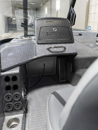 Slide: The Image of 2023 Caymas DV 20 boat dashboard with storage compartment and control panel. - 17