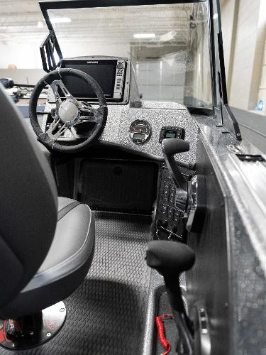 Slide: The Image of 2023 Caymas DV 20 boat cockpit with steering wheel and control panel. - 22