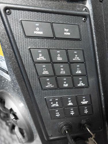 Slide: The Image of Control panel of 2023 Caymas DV 20 boat with various function buttons. - 27