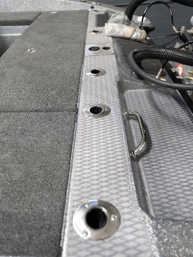 Slide: The Image of 2023 Caymas DV 20 boat interior with rod holders and storage compartments. - 36