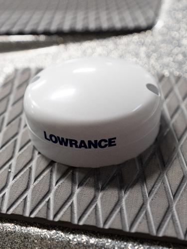 Slide: The Image of Lowrance device on 2023 Caymas DV 20 boat's textured surface. - 38