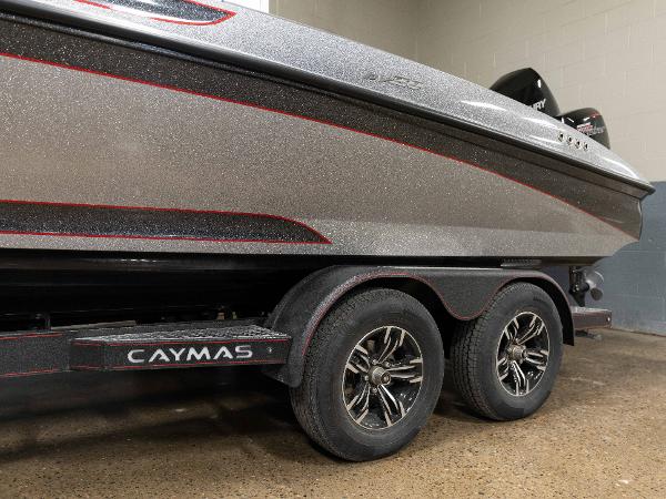 Slide: The Image of 2023 Caymas DV 20 boat on a trailer with dual axles in a garage. - 42