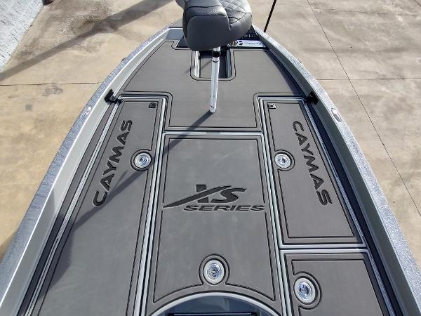 Slide: The Image of 2024 Caymas XS 20 Pro boat deck with seating and storage compartments. - 1