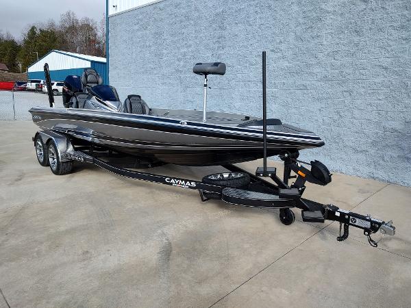Slide: The Image of 2024 Caymas XS 20 Pro fishing boat on trailer, parked outside. - 10