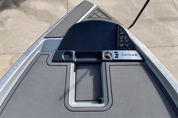 Slide: The Image of 2024 Caymas XS 20 Pro boat deck with control panel and storage compartments. - 3