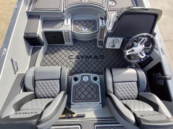 Slide: The Image of 2024 Caymas XS 20 Pro boat interior with dual seats and steering console. - 4