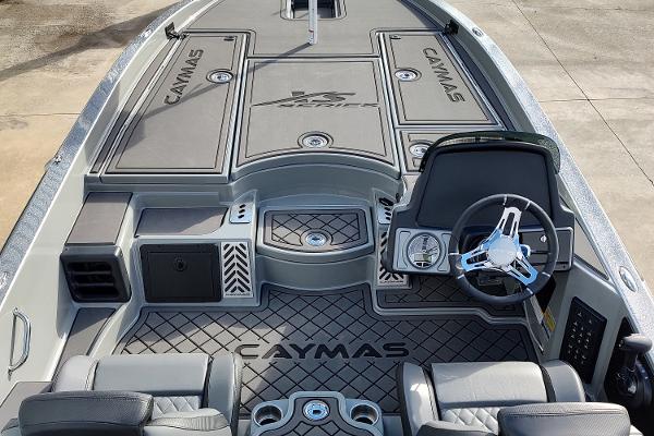 Slide: The Image of 2024 Caymas XS 20 Pro boat interior with steering wheel and seating. - 5