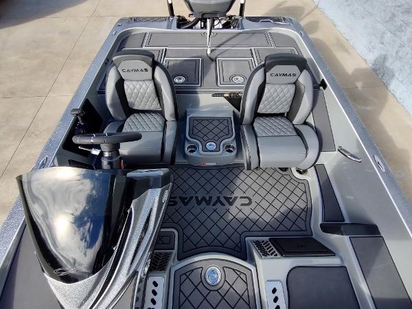 Slide: The Image of 2024 Caymas XS 20 Pro boat interior with dual seats and steering console. - 7