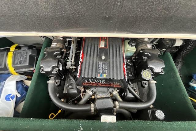 Slide: The Image of Engine of a 1995 Celebrity 180 Bowrider boat, showcasing a 4.3L V6 motor. - 12