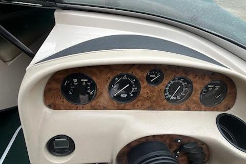 Slide: The Image of Dashboard of a 1995 Celebrity 180 Bowrider boat with gauges and controls. - 5