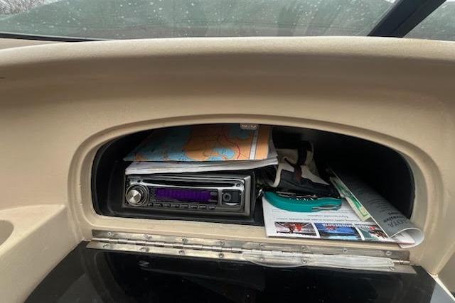 Slide: The Image of Dashboard storage in 1995 Celebrity 180 Bowrider boat with stereo and maps. - 6