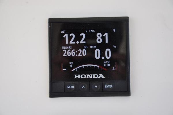 Slide: The Image of Honda engine display on a 2021 Century Coronado boat showing various metrics. - 18