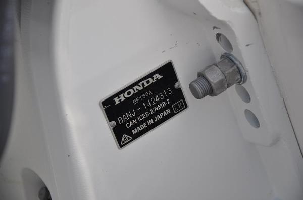 Slide: The Image of Honda engine label on a 2021 Century Coronado boat. - 30