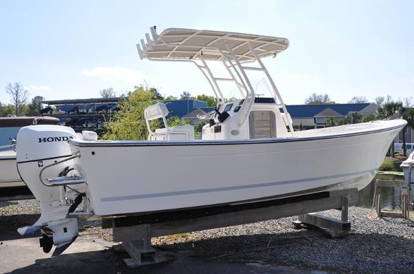 Slide: The Image of 2021 Century Coronado boat with Honda outboard motor on a stand. - 6