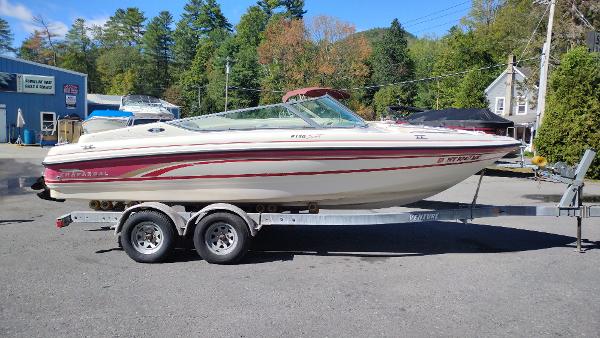 Slide: The Image of 1999 Chaparral 2130 SS boat on trailer, parked outdoors. - 4
