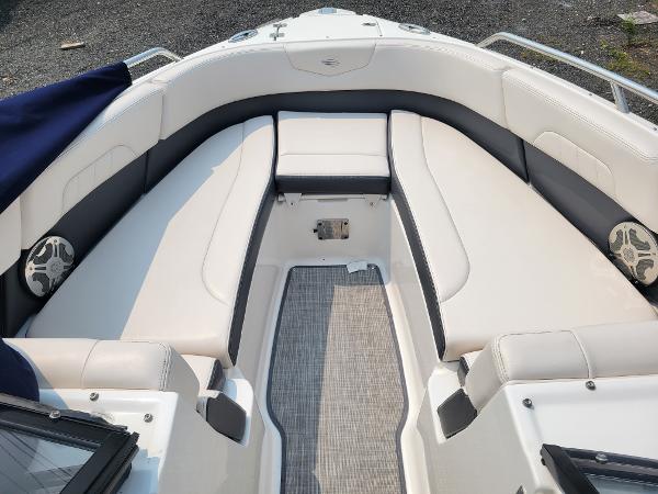 Slide: The Image of 2018 Chaparral 257 SSX boat interior with white and gray seating. - 18