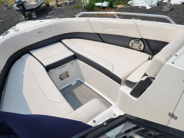 Slide: The Image of 2018 Chaparral 257 SSX boat interior with white and black seating. - 19