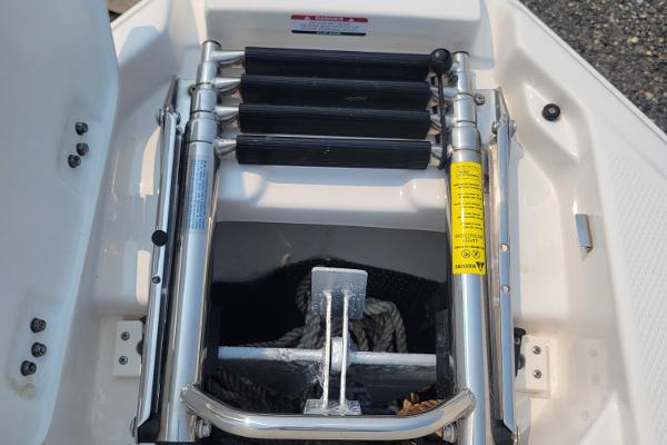Slide: The Image of 2018 Chaparral 257 SSX boat anchor storage with ladder. - 23