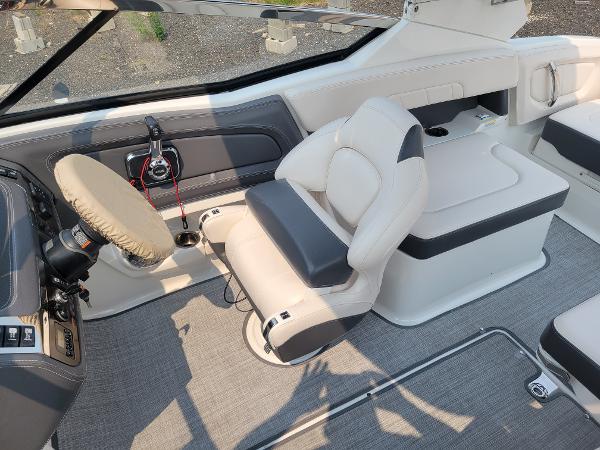 Slide: The Image of 2018 Chaparral 257 SSX boat interior with captain's chair and dashboard. - 6