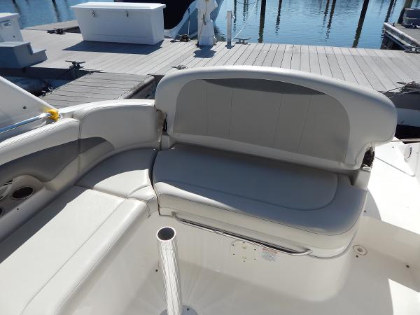 Slide: The Image of 2009 Chaparral 275 SSi boat interior with gray seating at dock. - 10