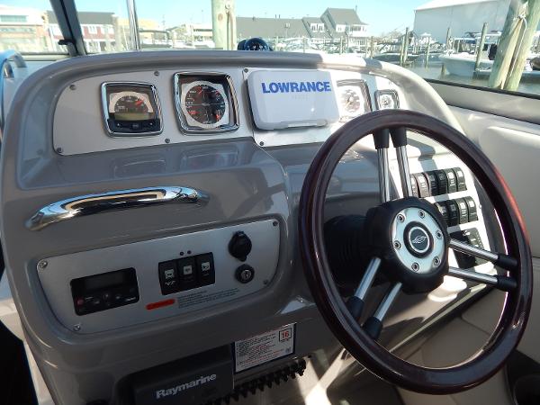 Slide: The Image of 2009 Chaparral 275 SSi boat dashboard with steering wheel and navigation instruments. - 11