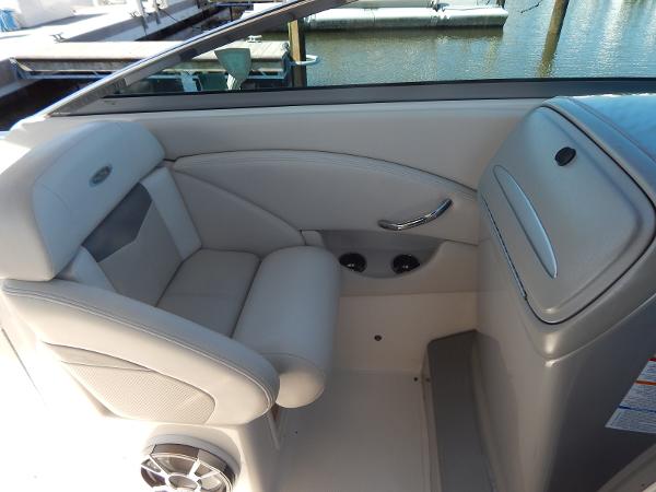 Slide: The Image of 2009 Chaparral 275 SSi boat interior with gray seating and speaker. - 13