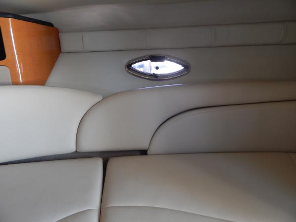 Slide: The Image of 2009 Chaparral 275 SSi interior with beige seating and small window. - 22