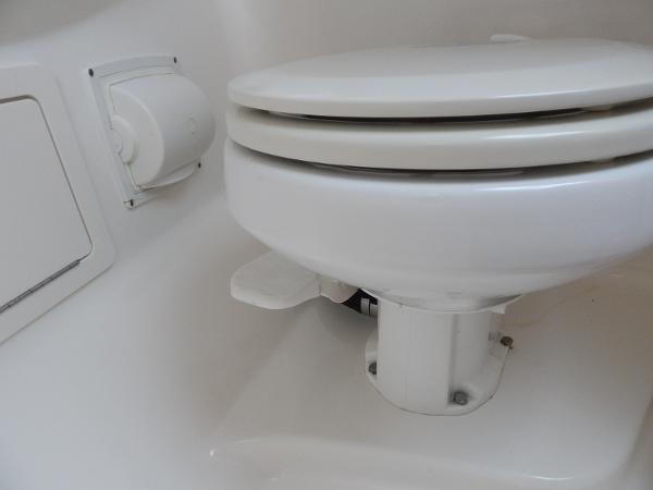 Slide: The Image of 2009 Chaparral 275 SSi boat toilet, white and compact design. - 24