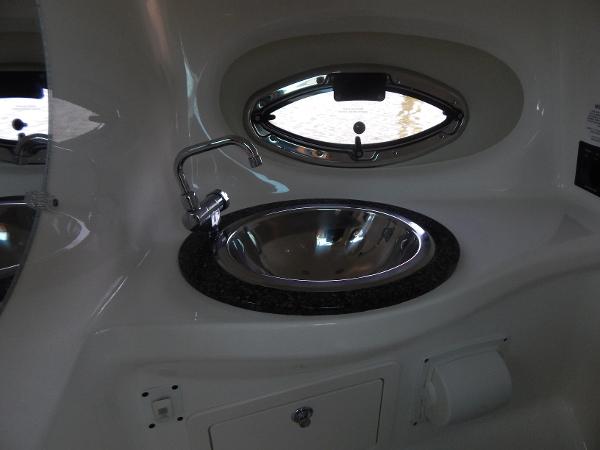 Slide: The Image of 2009 Chaparral 275 SSi boat interior with sink and oval window. - 25