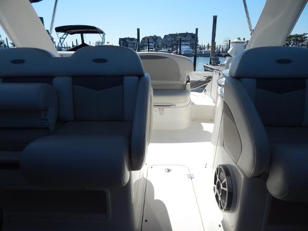 Slide: The Image of 2009 Chaparral 275 SSi boat interior with seating and marina view. - 26