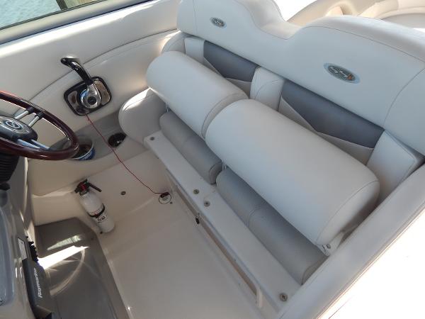 Slide: The Image of 2009 Chaparral 275 SSi boat interior with white seating and steering wheel. - 28
