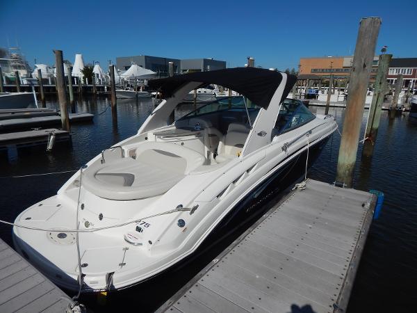 Slide: The Image of 2009 Chaparral 275 SSi boat docked at marina under clear blue sky. - 3