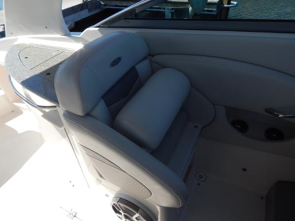 Slide: The Image of 2009 Chaparral 275 SSi boat interior with cushioned seating and speaker. - 30