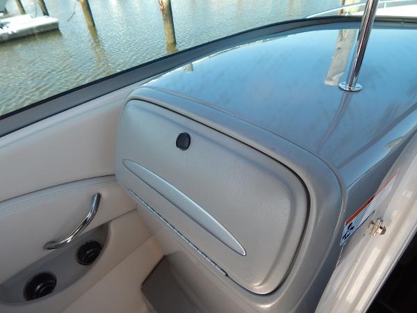 Slide: The Image of 2009 Chaparral 275 SSi boat interior with sleek dashboard and water view. - 31