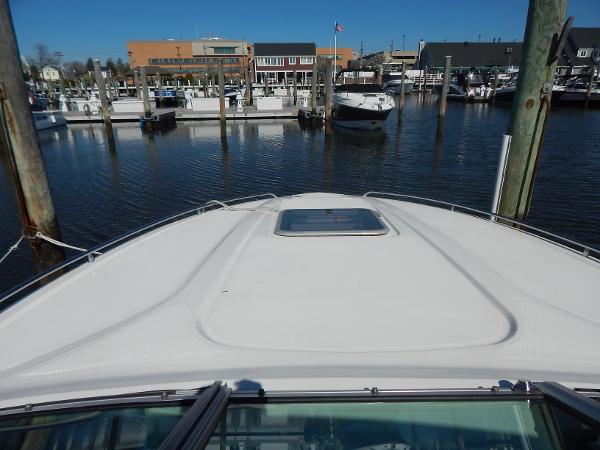 Slide: The Image of 2009 Chaparral 275 SSi boat docked at a marina with clear blue skies. - 33