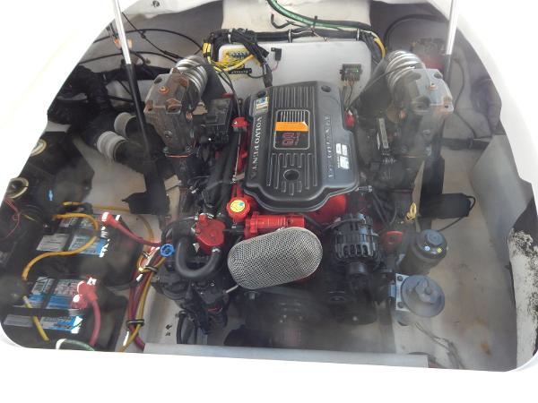 Slide: The Image of Engine compartment of a 2009 Chaparral 275 SSi boat, showcasing detailed components. - 35