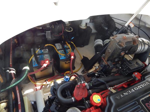 Slide: The Image of Engine compartment of a 2009 Chaparral 275 SSi boat with visible batteries and Volvo Penta engine. - 37