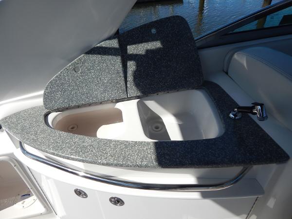 Slide: The Image of 2009 Chaparral 275 SSi boat sink with open lid, showcasing sleek design and functionality. - 42