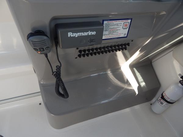 Slide: The Image of 2009 Chaparral 275 SSi boat dashboard with Raymarine equipment and fire extinguisher. - 46