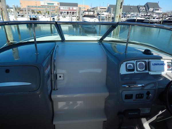 Slide: The Image of 2009 Chaparral 275 SSi boat dashboard with marina view in the background. - 8