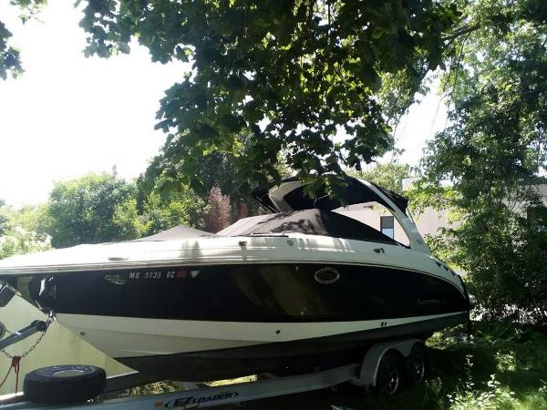 Slide: The Image of 2010 Chaparral 276ssx boat on trailer under trees. - 0